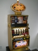 IGT CLEOPATRA FIVE REEL S2000 SLOT MACHINE WITH FREE SPIN BONUS AND LIGHTED TOPPER - 